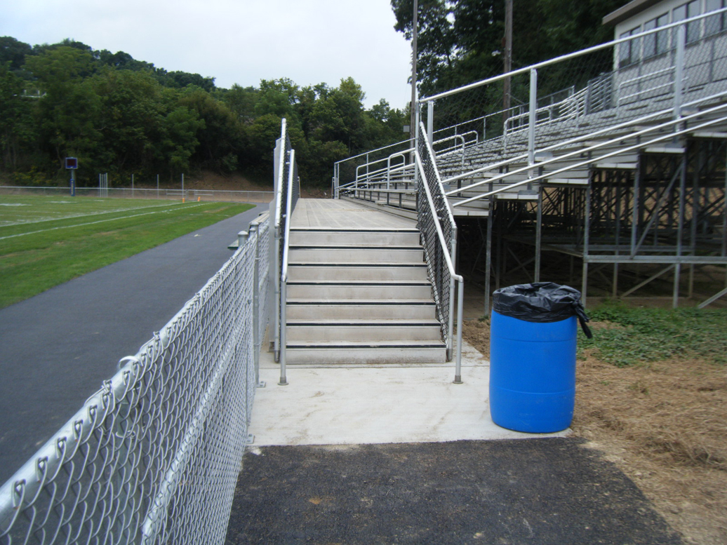 Existing structure needed a front walkway and for the structure to be cut back to get another lane on the running track